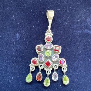 Sterling silver charm with garnet, peridot, and amethyst stones